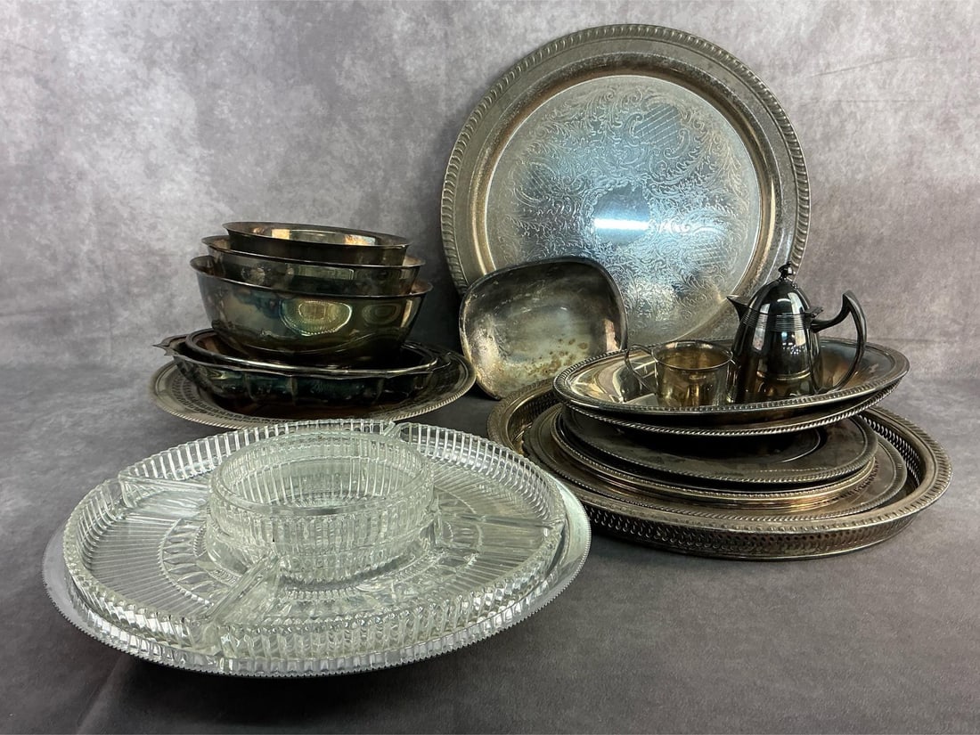 Silver Plated Finds: Silver plated serving trays, utensils, bowls, and more. All in good condition with tarnish present throughout. Largest server measures 15 inches in diameter.