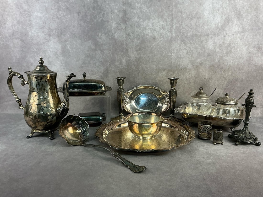 Silver Plated Finds: Silver plated serving trays, utensils, teapot, and more. All in good condition with tarnish present throughout. Largest server measures 13 inches in diameter.