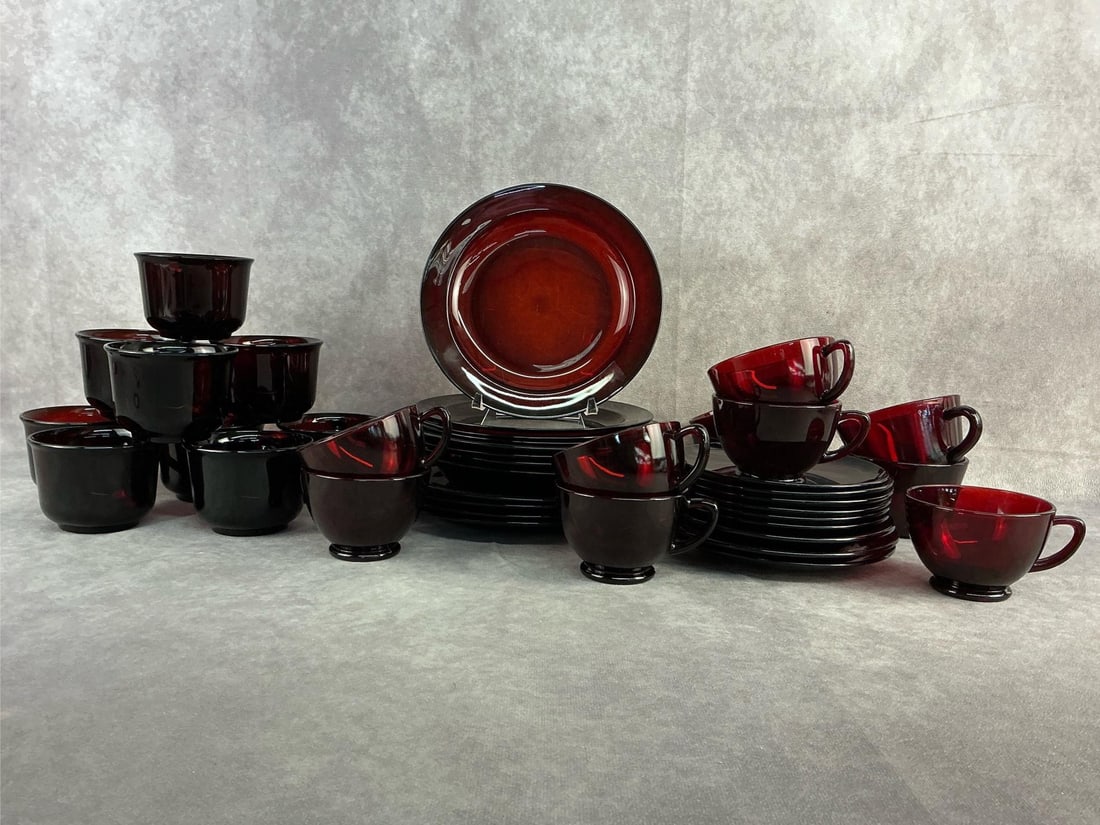 Ruby Red Glassware: Vintage Arcorac France glassware patterned in Ruby Red. Multiple styles of cups and plates. Small chip on the edge of one bowl, otherwise all in good condition. Dinner plate measures 9.25 inches