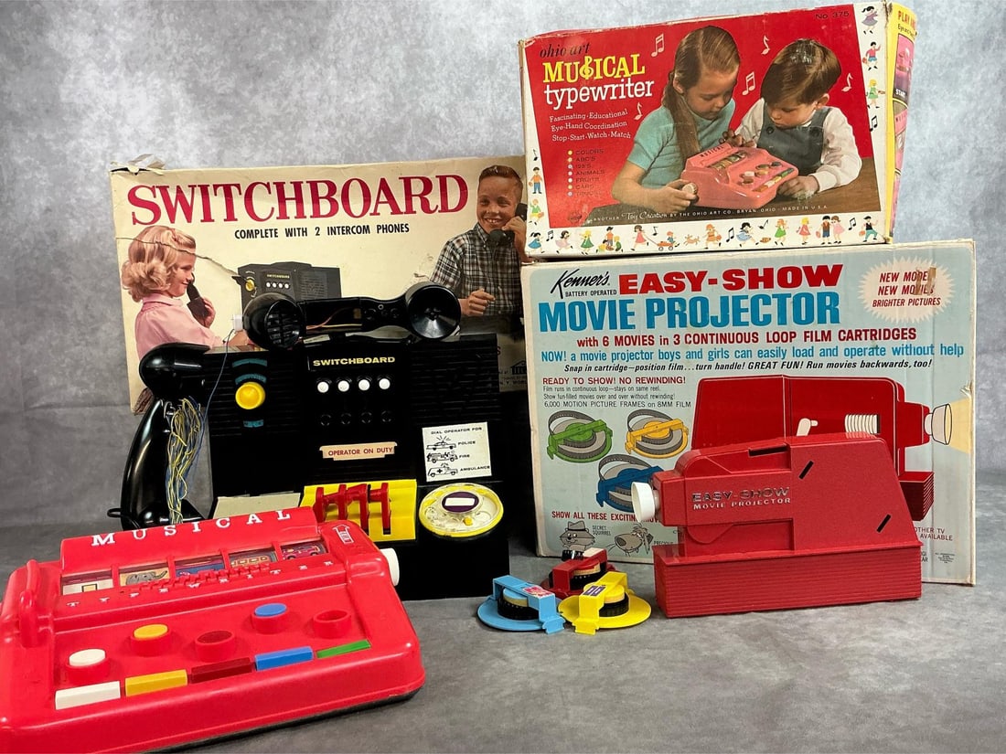 Vintage Toys: Three mid 1900's toys. Kenners Easy-Show movie projector with 3 reels, Switchboard with 2 phones, and Musical Typewriter. Toys are untested, typewriter does not play music. Switchboard box measures