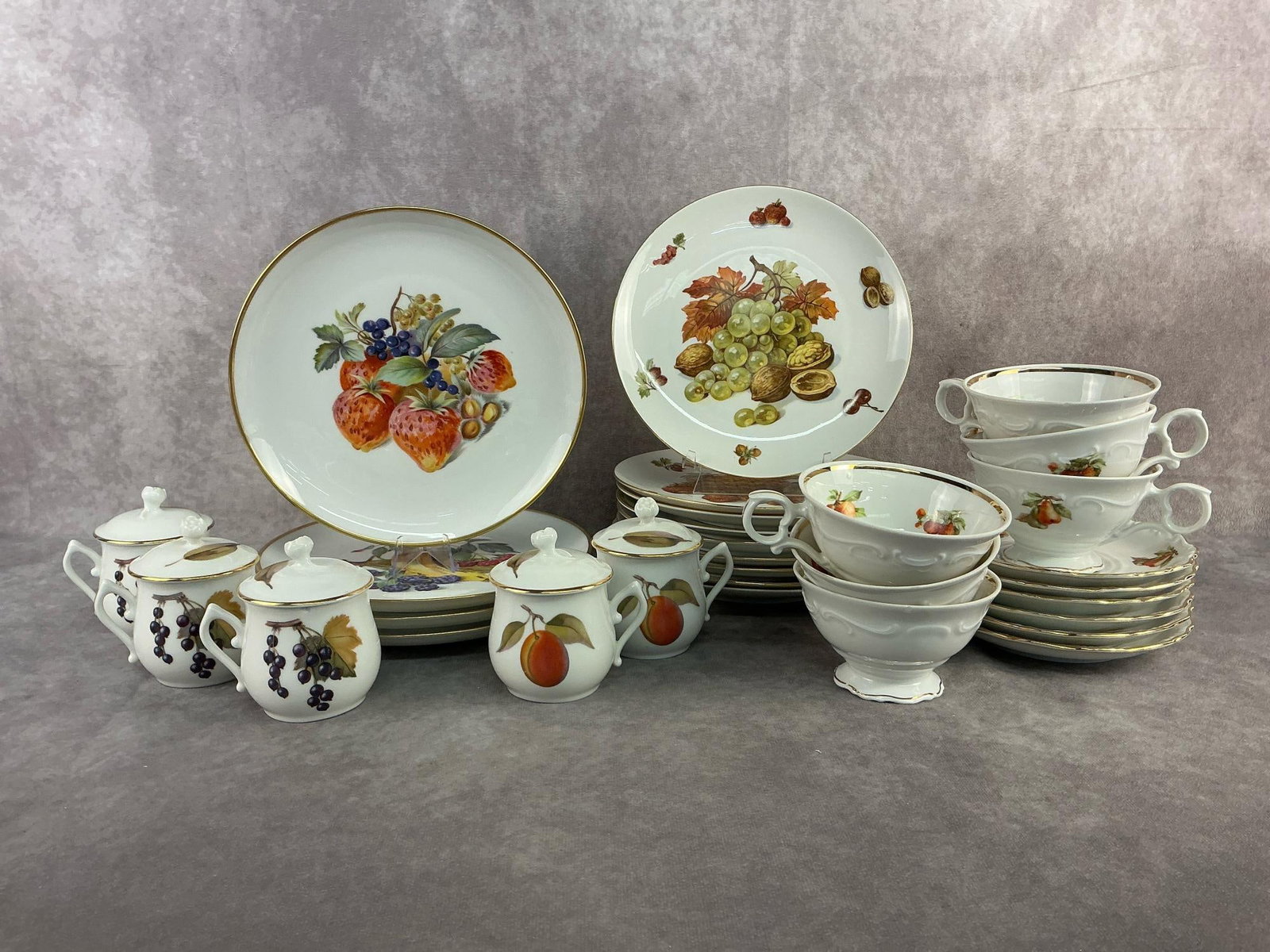 Bavaria & More: Five Royal Worcester crème cups and multiple styles of Bavaria chinaware. One of the crème cups has a chip on the edge, otherwise all in good condition and stamped. Largest plate measures 8 inches i