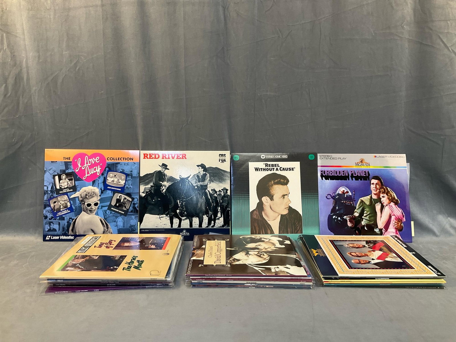 Laser Discs: Twenty three 1980's-90's classic laser disc movies including; "Rebel Without A Cause", "Red River" with John Wayne, "The I Love Lucy Collection ", "The Maltese Falcon" with Humphrey Bogart,