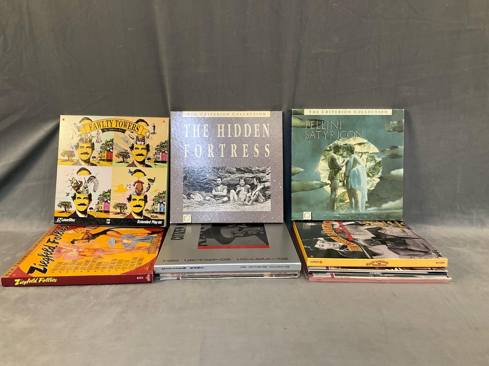 Laser Discs: Six 1980's-90's laser disc boxed sets and six laser discs including; "Fellini Satyricon" box set, "The Hidden Fortress " box set, "Citizen Kane" box set, " Family Towers" boxed set and "Guys and