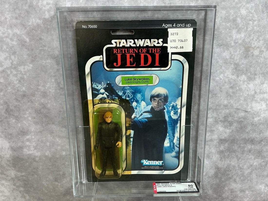 Luke Skywalker Jedi Knight 80 Y-NM ROTJ: 1983, 65 Back-A Return of the Jedi Luke Skywalker Jedi Knight outfit made by Kenner in Taiwan. AFA graded 80 Y-NM with subgrades C80 B80 F90. Case measures 7.25 inches wide x 1.5 x 9.75 inches tall.