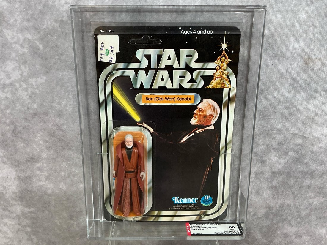 Obi-Wan Kenobi 80 NM: 1978, 12 Back A Grey Hair variant Star Wars Ben Obi-Wan Kenobi made by Kenner in Hong Kong. AFA graded 80 NM with subgrades: C85 B85 F75. Card is unpunched. Case measures 7.25 inches wide x 1.5 x