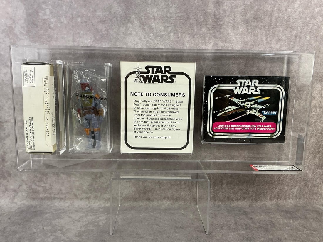 Boba Fett Mail Order 75 EX+/NM: 1979 mail order Boba Fett figure with original mailer box, insert, and small catalog. AFA graded 75 EX+/NM with subgrades: B70 W80 F80. Case measures 15 inches long x 2 x 6.25 inches tall.