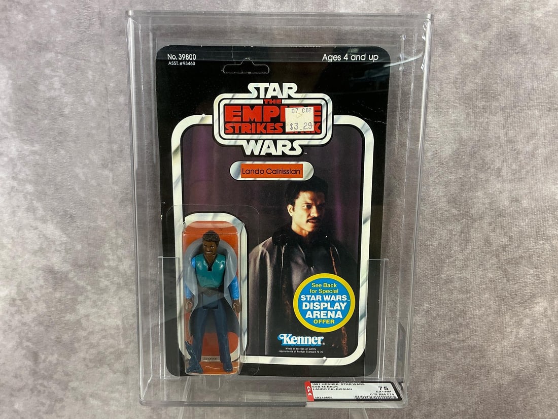 Lando Calrissian ESB 75 EX+/NM: 1981, 45 back, Lando Calrissian with white teeth Empire Strikes Back made by Kenner in Hong Kong. AFA graded 75 EX+/NM with subgrades: C75 B85 F70. Card is unpunched. Case measures 7.25 inches wide x 