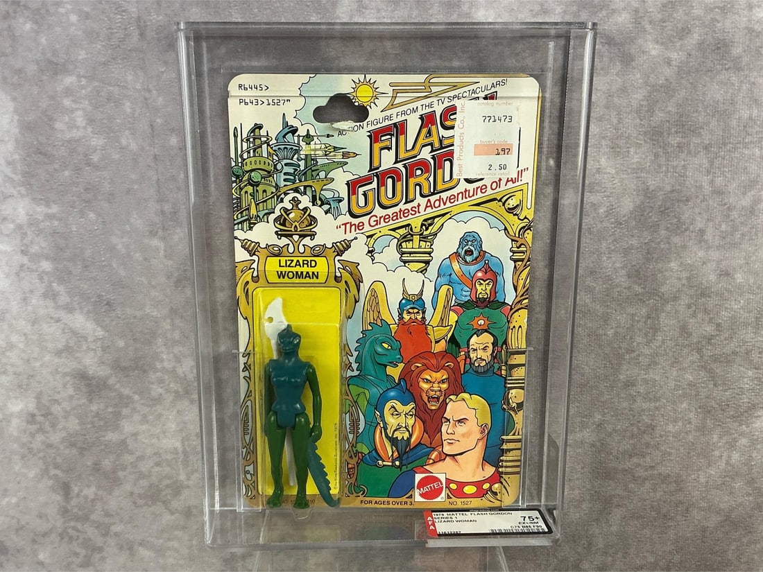 Lizard Woman 75+ EX+/NM: 1979 series one Flash Gordon Lizard Woman made by Mattel in Hong Kong. AFA graded 75+ EX+/NM with subgrades C75 B85 F90. Case measures 7.25 inches wide x 1.5 x 9.75 inches tall.