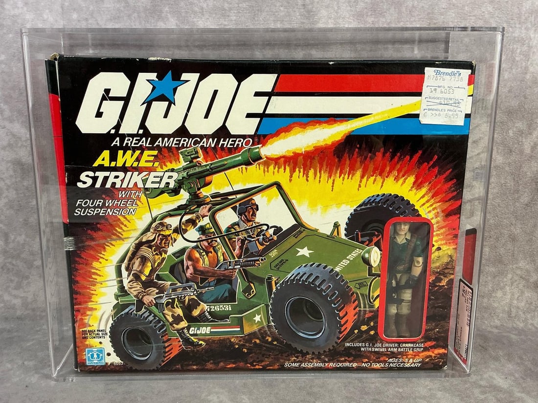 A.W.E. Striker GI Joe 75+ EX+/NM: 1985 series four A.W.E. Striker vehicle with driver made by Hasbro in Hong Kong. AFA 75+ EX+/NM with subgrades B75 W85 F90. Case measures 12.5 inches wide x 3.75 x 10 inches tall.