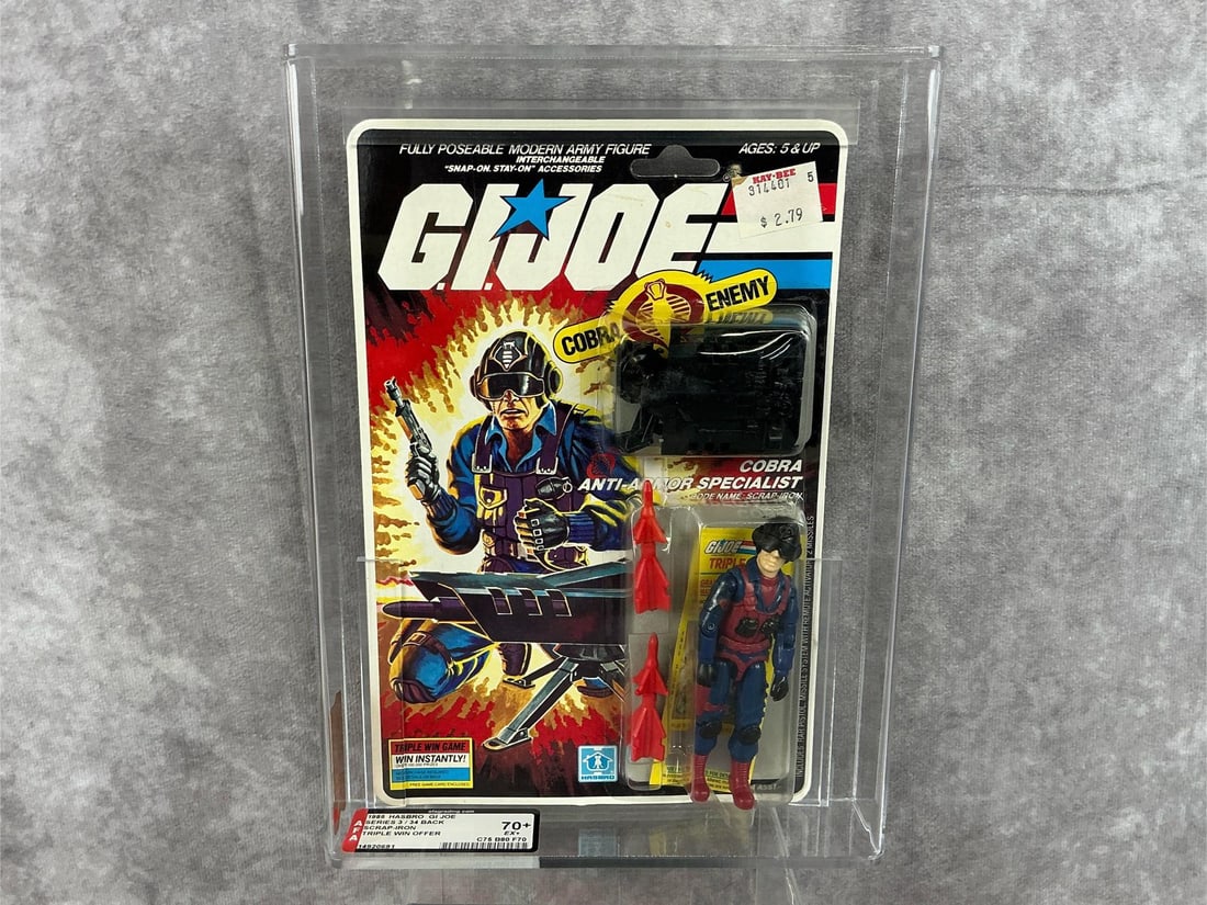 Scrap Iron GI Joe 70+: 1985 series three 34 back with triple win offer, G.I. Joe Scrap-Iron made by Hasbro in Hong Kong. AFA graded 70+ EX+ with subgrades: C75 B80 F70. Only eight in population at time of listing. Case meas