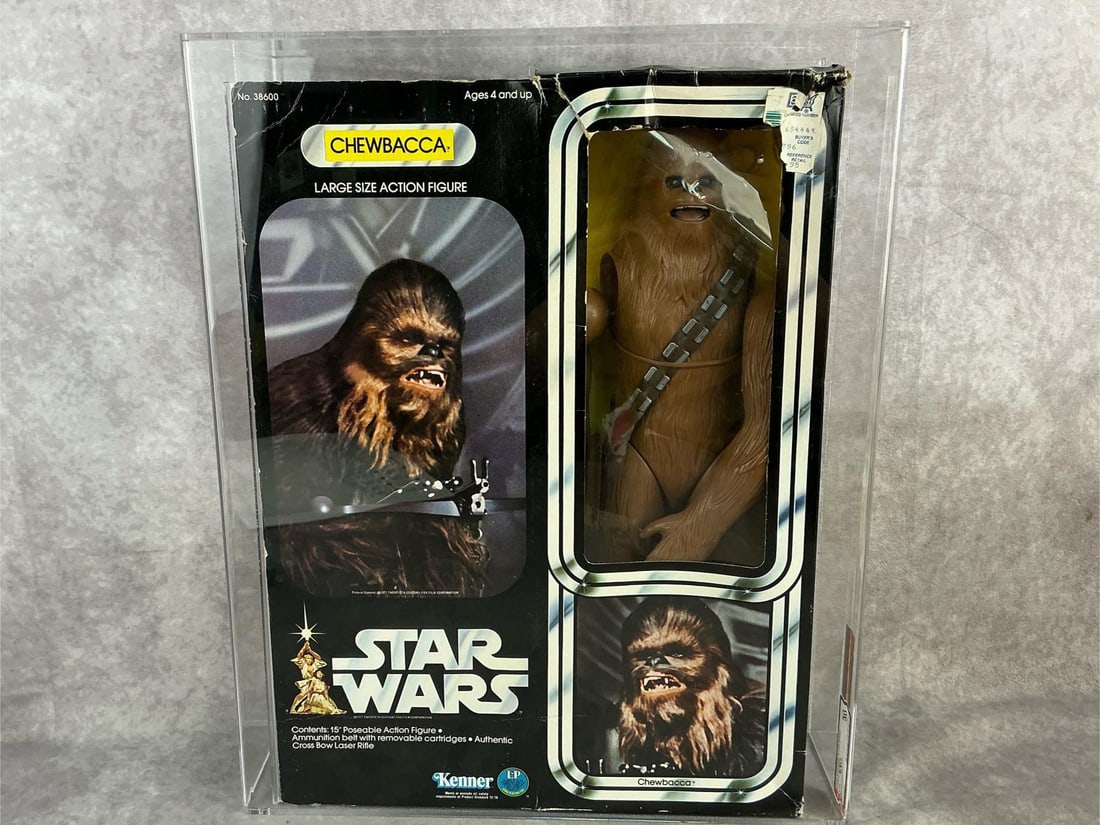 Chewbacca 12 Inch Series 50 VG: 1978 Star Wars 12 inch series Chewbacca made by Kenner in Hong Kong. AFA graded 50 VG with subgrades B40 W70 F50. Case measures 13.75 inches wide x 3.75 x 17 inches tall.