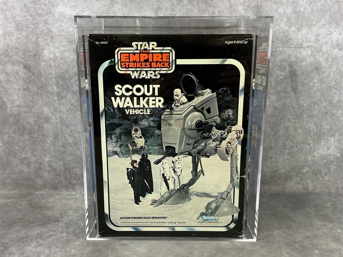 Scout Walker ESB 80 NM: 1982 Star Wars Empire Strikes Back, Scout Walker Vehicle made by Kenner with Hong Kong blacked out. AFA graded 80 NM. Case measures 10 inches wide x 7.5 x 12.5 inches tall.