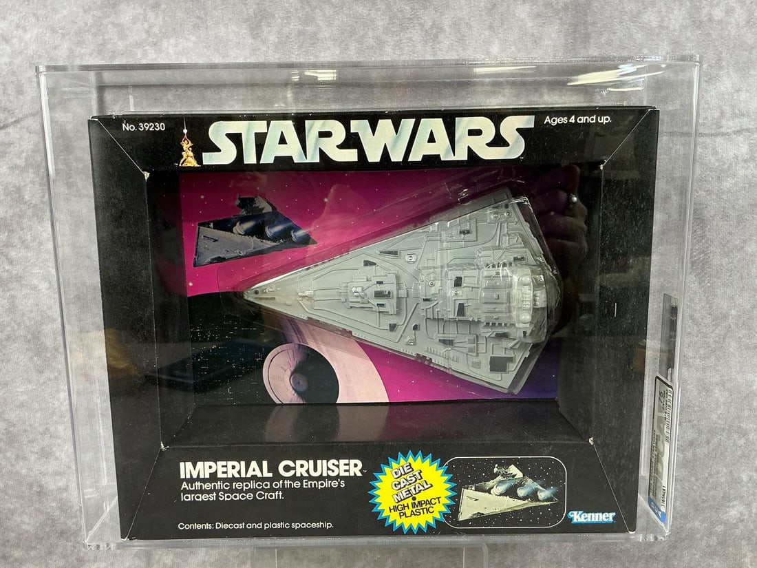 Imperial Cruiser 75 EX+/NM: 1979 Star Wars Imperial Cruiser made by Kenner in Hong Kong. DCA graded 75 EX+/NM with subgrades B75 W80 V85. Case measures 12.25 inches wide x 3.25 x 9.5 inches tall.