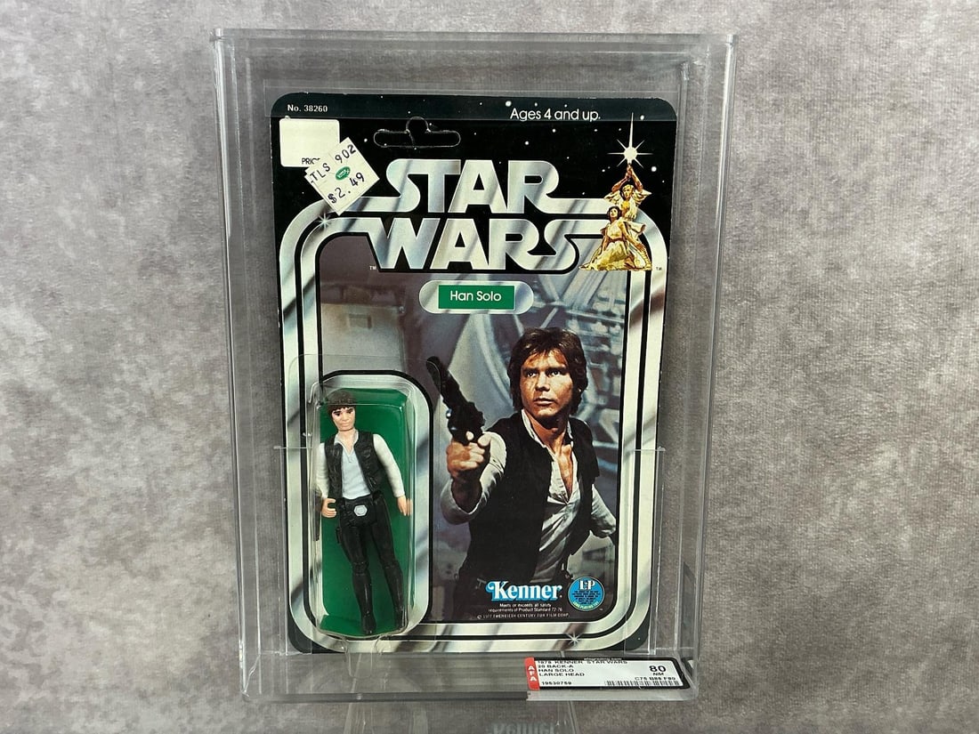 Han Solo Large Head 80 NM: 1978, 20 Back-A Star Wars Han Solo large head variation made by Kenner in Hong Kong. AFA graded 80 NM with subgrades C75 B85 F80. Card is unpunched. Case measures 7.25 inches wide x 1.5 x 9.75 inches 