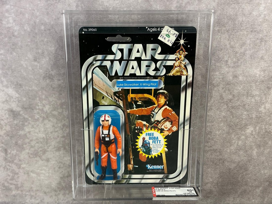 Luke Skywalker Pilot 80+ NM: 1978, 20 Back-D Star Wars Luke Skywalker X-Wing Pilot made by Kenner in Hong Kong. AFA graded 80+ NM with subgrades C80 B85 F80. Only one other at grade level at time of listing. Case measures 7.25