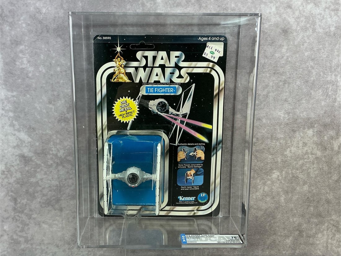 TIE Fighter 75 EX+/NM: 1978, 12 Back Star Wars diecast TIE Fighter made by Kenner in Hong Kong. DCA graded 75 EX+/NM with subgrades C80 B70 V85. Card is unpunched. Case measures 8.25 inches wide x 3.5 x 10.75 inches tall.