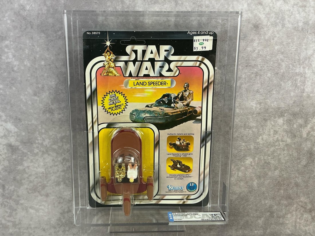 Land Speeder 75+ EX+/NM: 1978, 12 Back Star Wars diecast Land Speeder made by Kenner in Hong Kong. DCA graded 75+ EX+/NM with subgrades C75 B85 V85. Card is unpunched. Case measures 8.25 inches wide x 2 x 10.75 inches tall.
