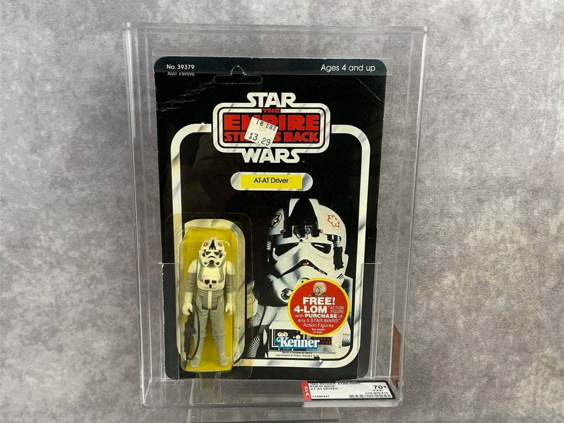 AT-AT Driver ESB 70+ Y-EX+: 1982, 47 Back Star Wars The Empire Strikes Back AT-AT Driver made by Kenner in Hong Kong. AFA graded 70+ Y-EX+ with subgrades C75 B70 F75. Features Free 4-LOM action figure offer on card. Card is