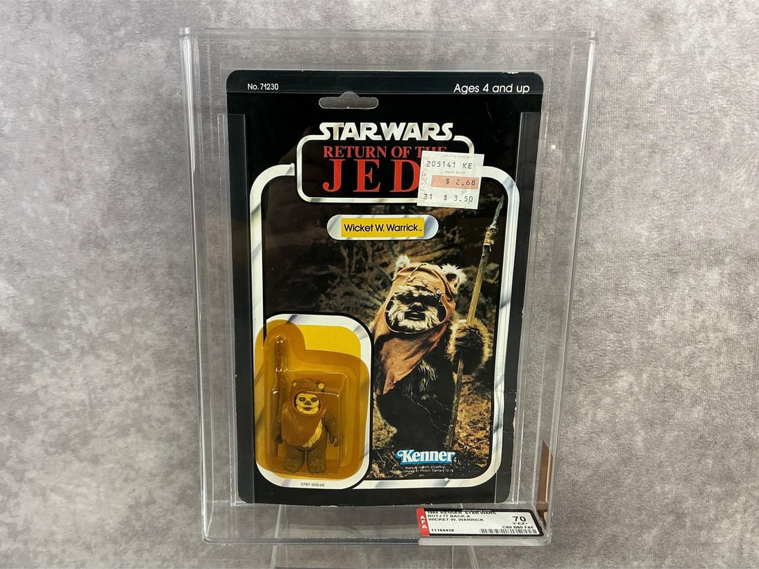 Wicket W. Warrick ROTJ 70 Y-EX+: 1984, 77 Back-A Star Wars Return Of The Jedi Wicket W. Warrick action figure made by Kenner in Taiwan. AFA graded 70 Y-EX+ with subgrades C60 B80 F85. Case measures 7.25 inches wide x 1.5 x 9.75