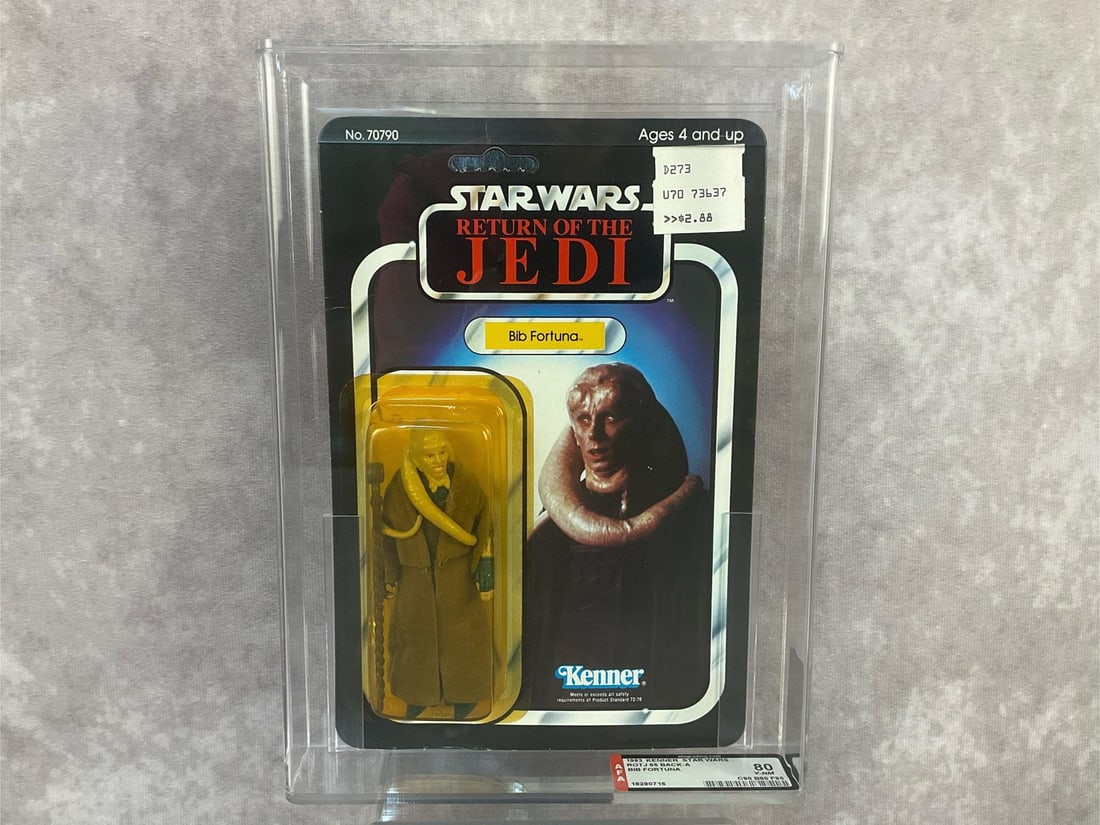 Bib Fortuna 80 Y-NM: 1983, 65 Back Star Wars Return of the Jedi Bib Fortuna action figure made by Kenner in Hong Kong. AFA graded 80 Y-NM with subgrades C80 B80 F85. Card is unpunched. Case measures 7.25 inches wide x