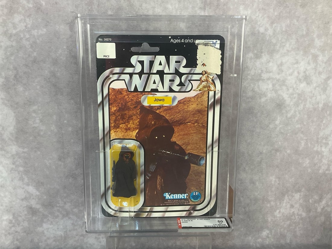 Jawa 50 VG: 1978, 12 Back-B Star Wars Jawa action figure made by Kenner in Hong Kong. AFA graded 50 VG with subgrades C40 B85 F80. Case measures 7.25 inches wide x 1.5 x 9.75 inches tall.
