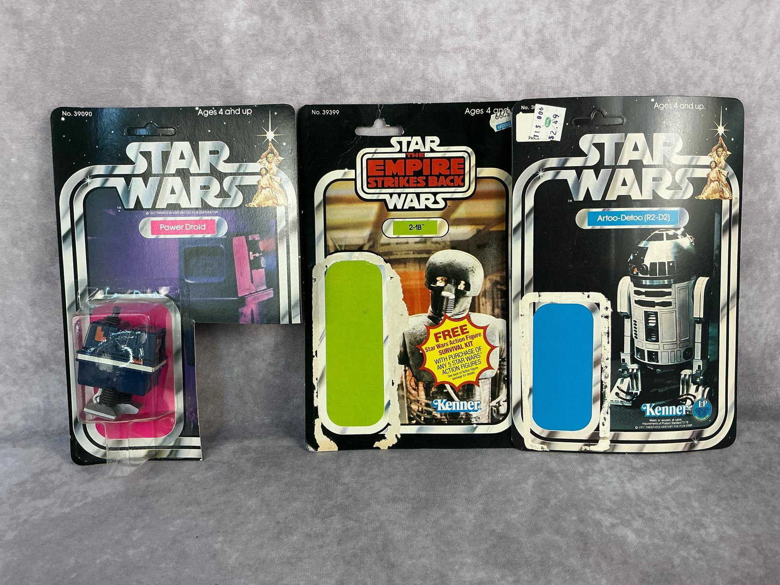 Power Droid & Card Backs: 1978 Star Wars Power Droid on original card back, two additional card backs with no figures. Power Droid card back is unpunched, and has been cut for proof of purchase. Each measures 6 inches wide x