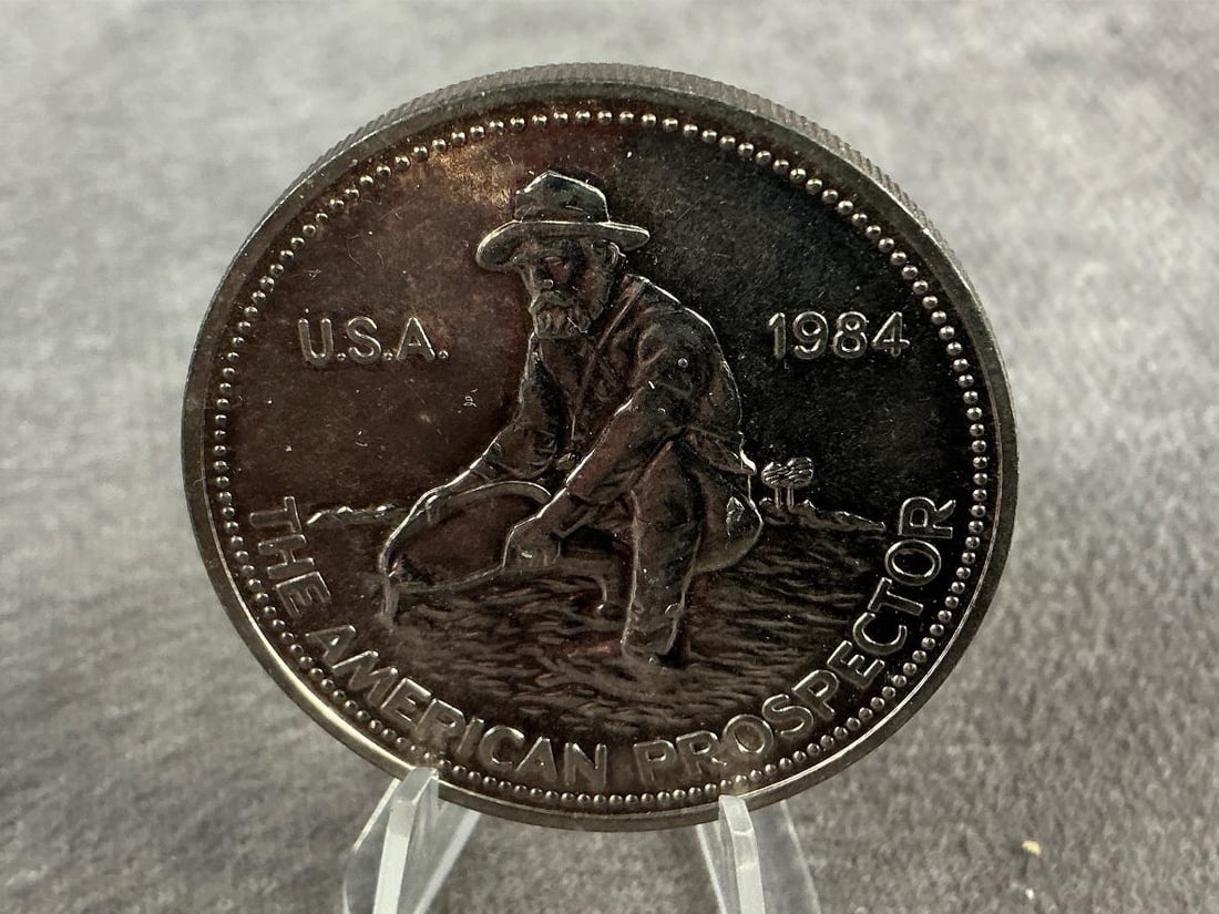 Engelhard Coin: 1984 Engelhard the American Prospector coin. In good condition and contains .999 fine silver. Total weight 1ozt.