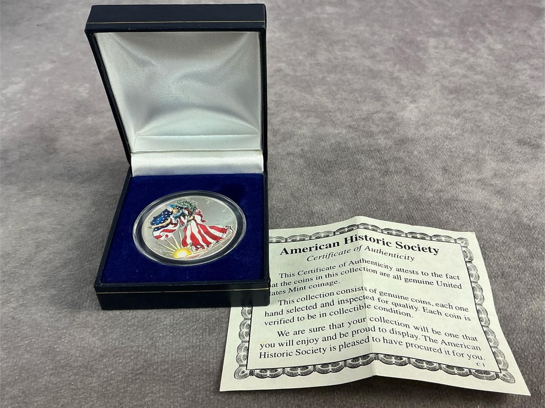 Walking Liberty: 1999 American Eagle hand painted enamel on Walking Liberty design. In good condition and contains .999 fine silver. Total weight 1 ozt.