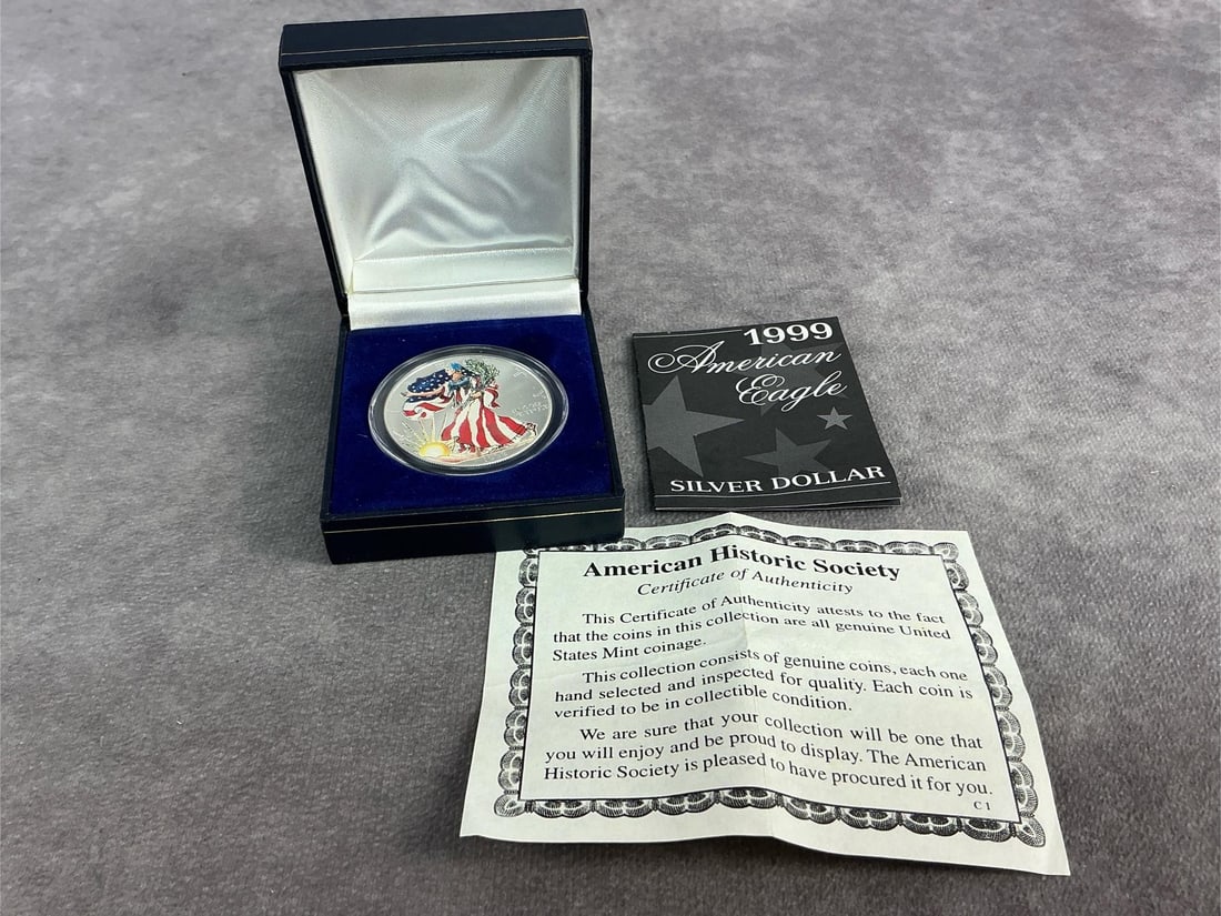 Walking Liberty: 1999 American Eagle hand painted enamel on Walking Liberty design. In good condition and contains .999 fine silver. Total weight 1 ozt.