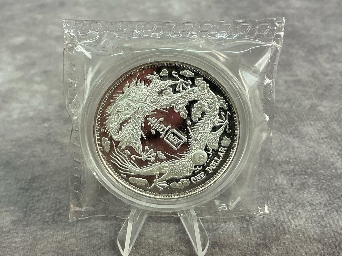 Dragon Dollar: 2019 China long whiskered dragon dollar. Uncirculated and contains .999 fine silver. Total weight 1 ozt.