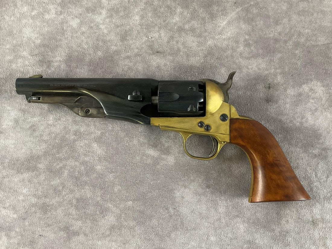 F.lli Pietta Black Powder Revolver: Serial # 431769 .36 Caliber black powder percussion revolver reproduction by F.lli Pietta in blued and brass colors. In good condition, clean bore, never fired, with mild tarnish and patina on the