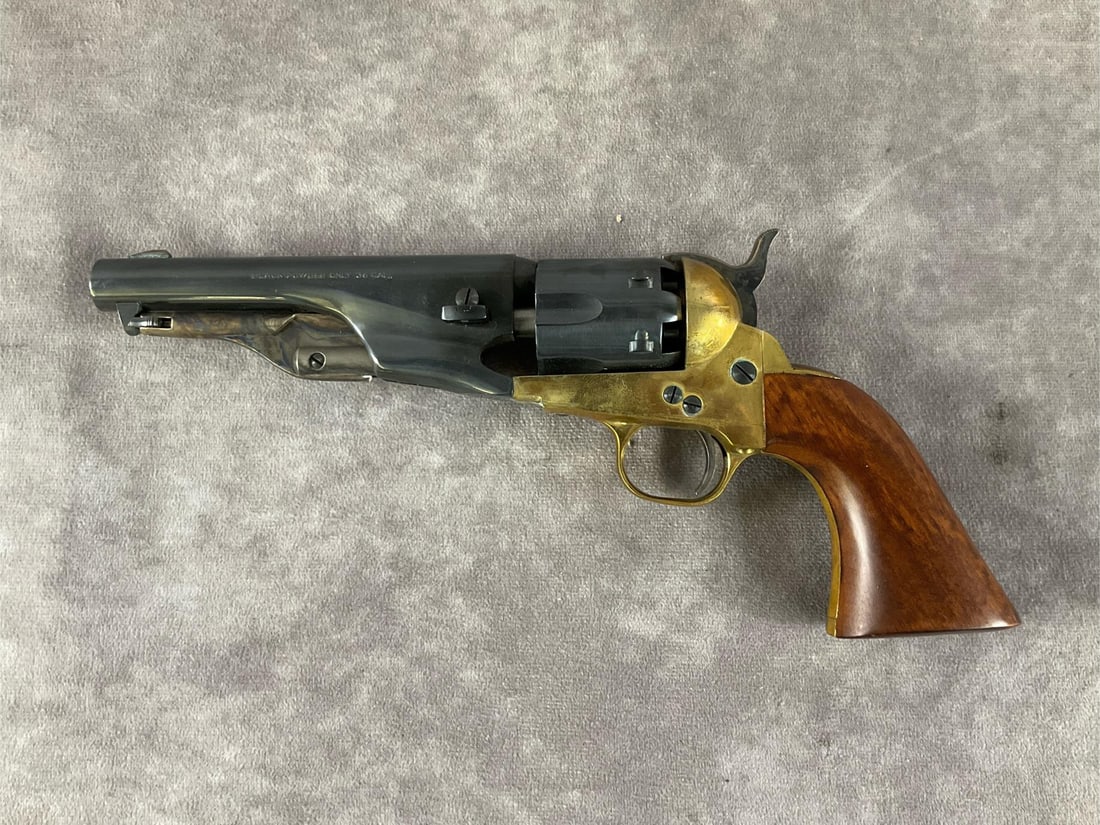 F.lli Pietta Black Powder Revolver: Serial # 427737 .36 Caliber black powder percussion revolver by F.Lli Pietta in blued and brass finish. In good condition with minor brass tarnish. Clean bore, never fired. Barrel length 5 1/2