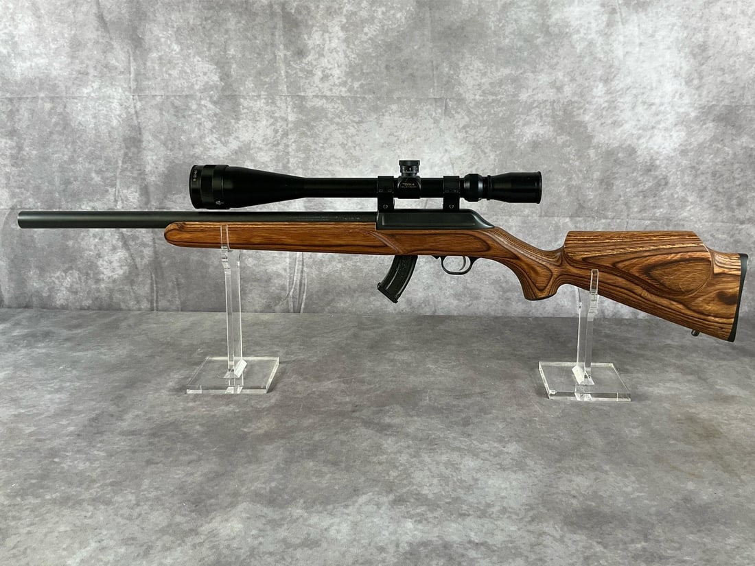 Thompson/Center Arms TC 22LR Classic Rifle: Serial # T2001 Caliber .22 LR TC 22LR Classic Rifle by Thompson/Center Arms, color laminate wood and black. In good condition featuring a mounted BSA Platinum 8-32x44 scope. Includes box, soft case,