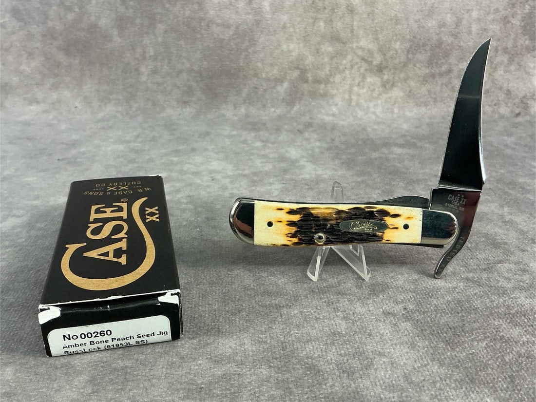 Amberbone Knife: Case XX amberbone knife. Russ lock, patterned 61953L, tight snap and comes with original box. Box measures 4.5 inches wide x 1.75 inches tall.