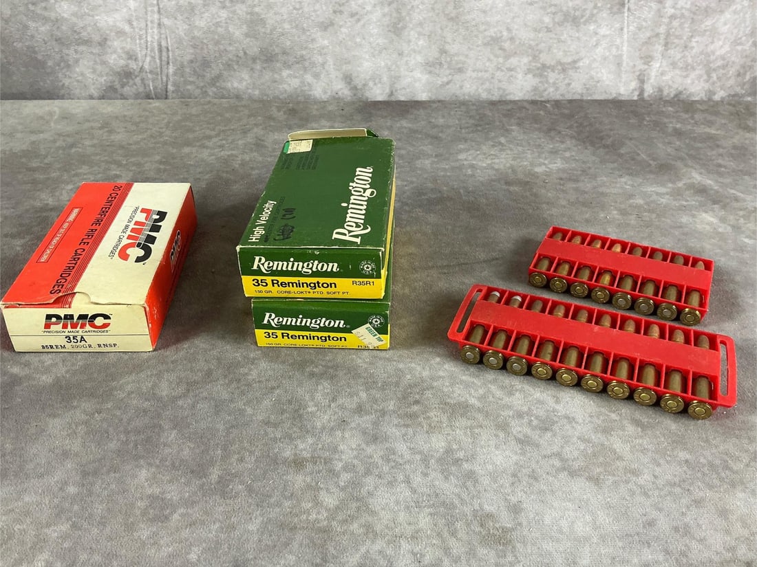 PMC and Remington .35 Remington Ammunition: 78 total .35 Remington centerfire rifle cartridges by PMC and Remington in brass. In good condition. Box measures 6 inches long X 3 inches wide X 1 1/2 inches high.