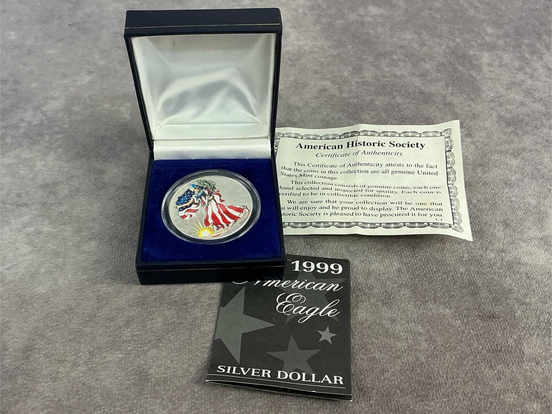 Walking Liberty: 1999 American Eagle hand painted enamel on Walking Liberty design. In good condition and contains .999 fine silver. Total weight 1 ozt.