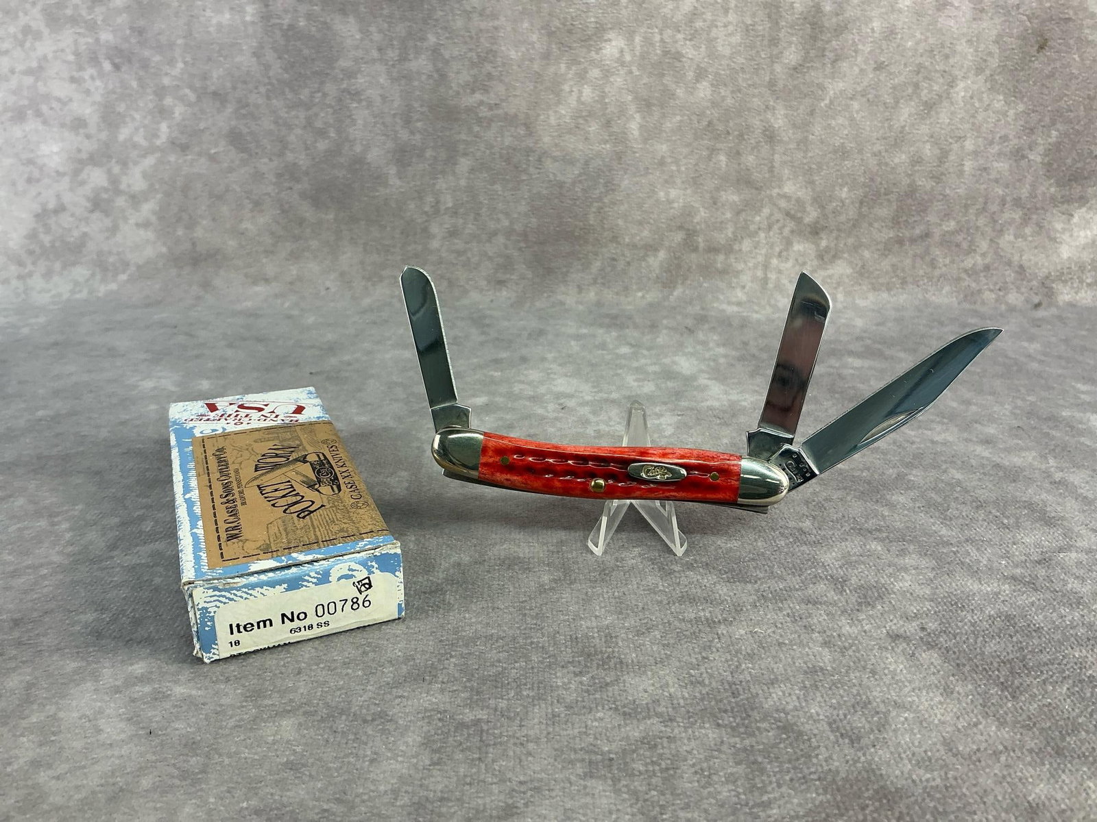 Red Stockman Knife: Case XX knife. Stockman, patterened 6318ss, tight snap and comes with original box. Box measures 4.5 inches wide x 1.75 inches tall.