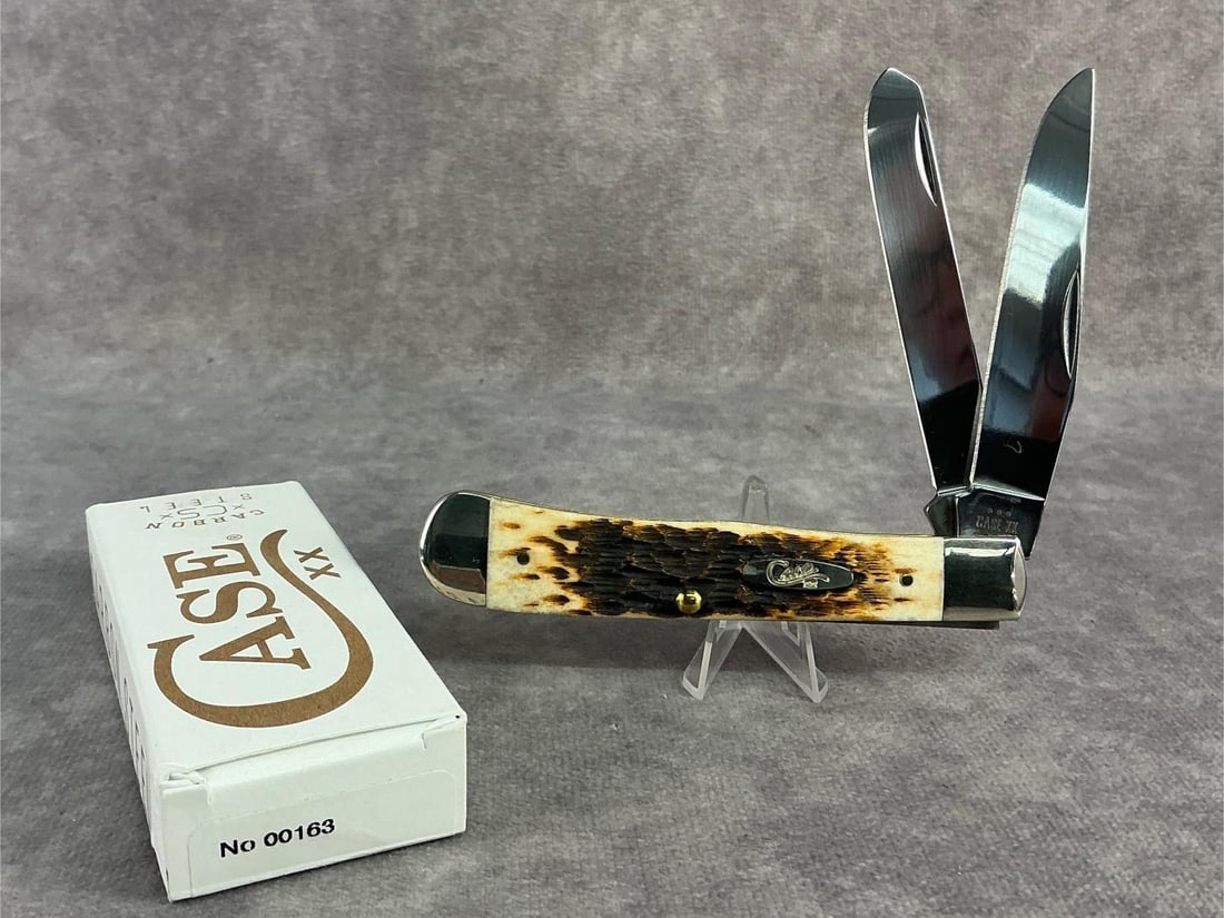 Amber Bone Knife: Case XX knife. Trapper, patterened 6254ss, tight snap and comes with original box. Box measures 4.5 inches wide x 1.75 inches tall.