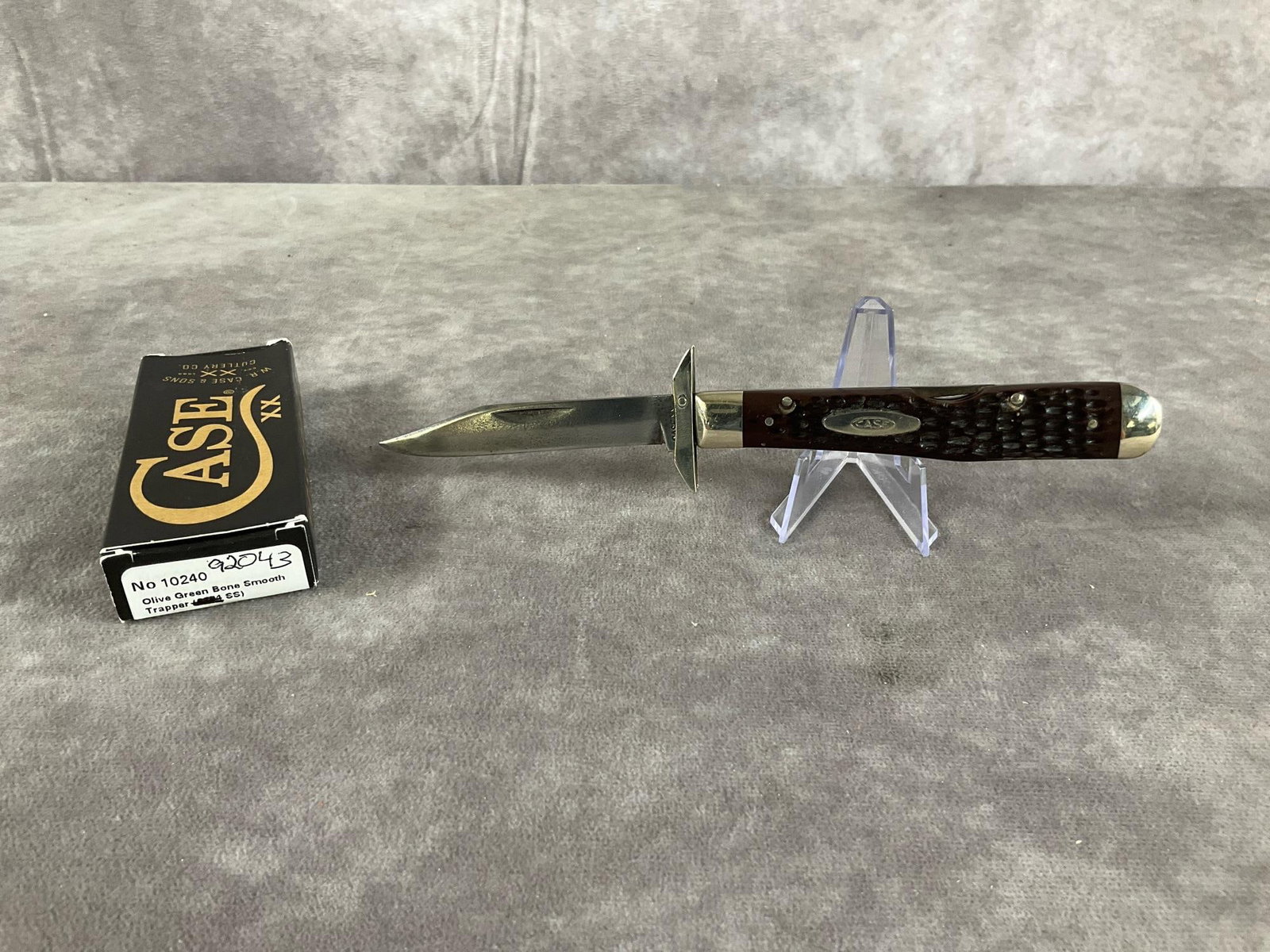 Cheetah Swing Knife: 1967 Case XX cheetah swing knife. Lockback, patterned 6111 1/2L, tight snap, appears sharpened, in box but not original. Box measures 4.5 inches wide x 1.75 inches tall.