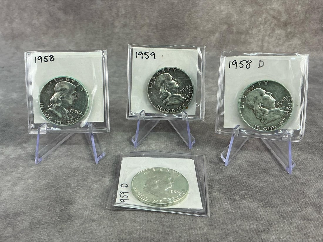 Franklin Halves: Four 1958 and 1959 Franklin half dollars, 90% silver. All in fair to good circulated condition. Total weight 1.89 ozt.