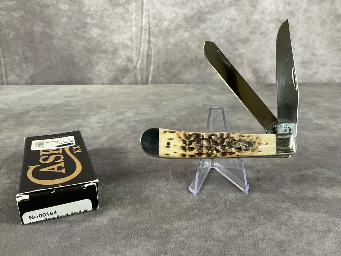 Amber Jigged Bone Knife: Case XX Trapper 6254ss. Tight snap, includes original box. Box measures 4.5 inches wide X 1.75 inches tall.