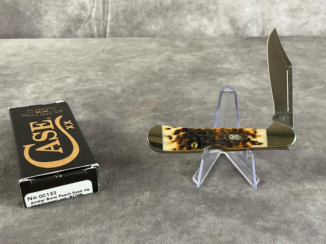Amber Bone Peach Seed Jigged Knife: Case XX Mini CopperLock 61749lss. Tight snap, includes original box. Box measures 4.5 inches wide X 1.75 inches tall.