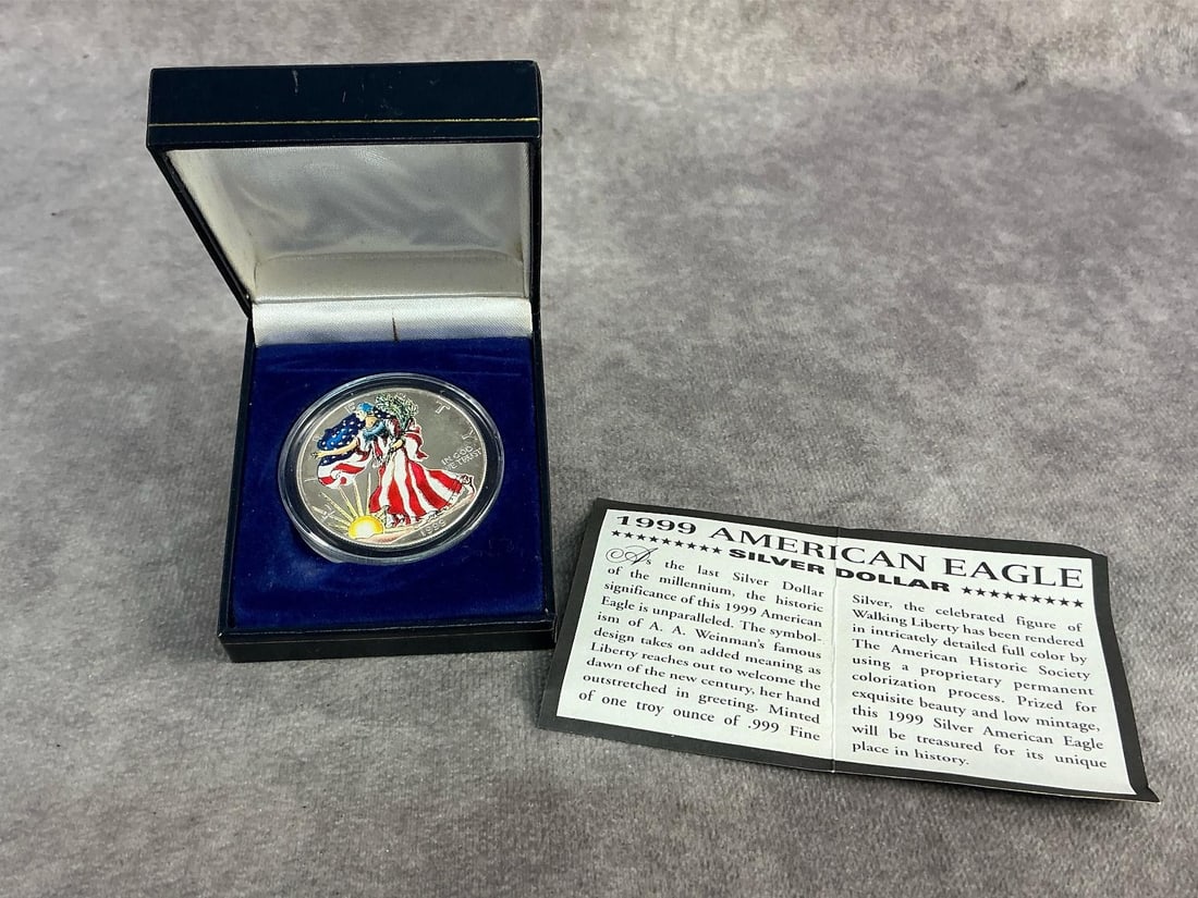 Walking Liberty: 1999 American Eagle hand painted enamel on Walking Liberty design. In good condition and contains .999 fine silver. Total weight 1 ozt.