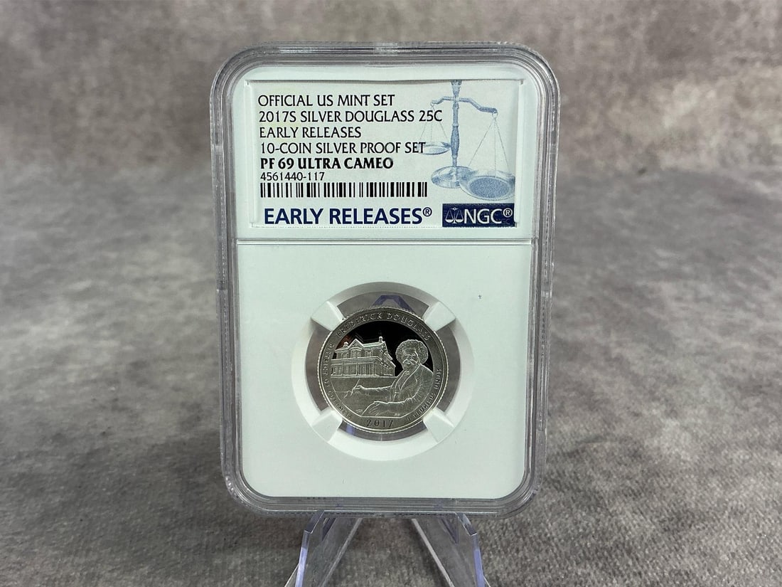 Douglass Quarter: 2017S silver Frederick Douglass Quarter, PF 69 ultra cameo, graded by NGC. Certification number 4561440-117. Measures 2.25 inches wide x 3.25 inches tall.