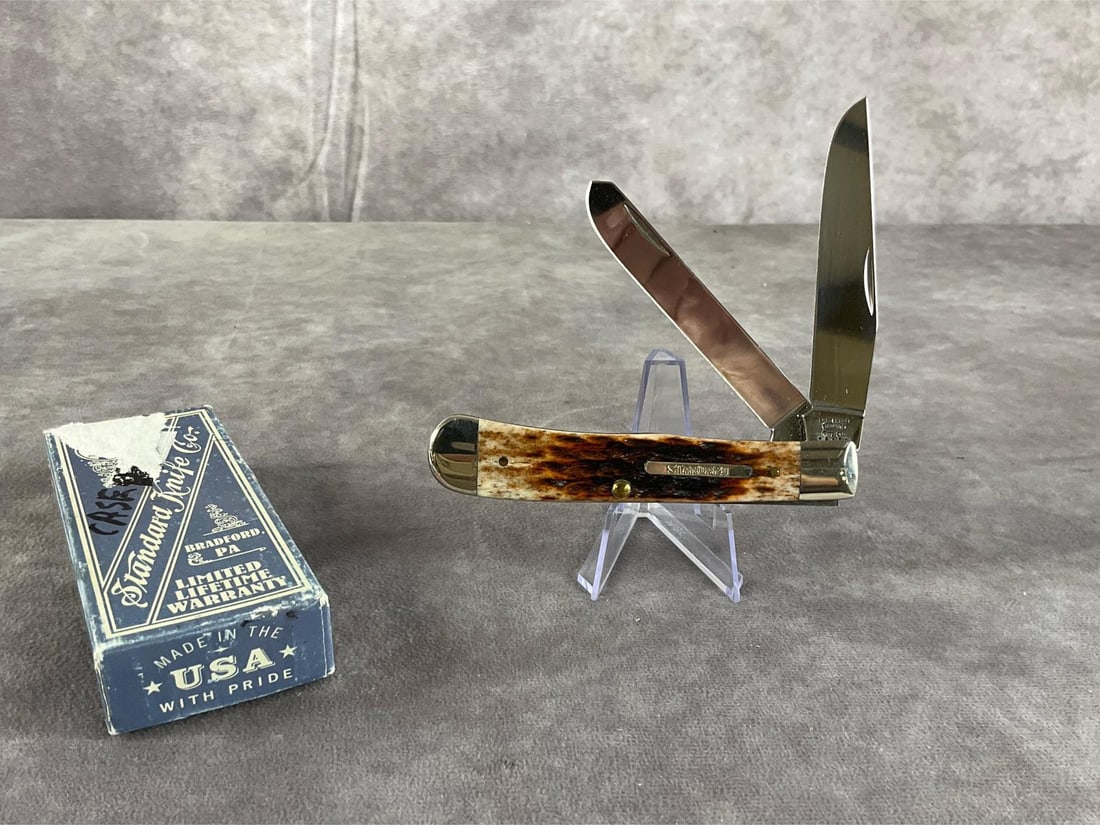 Burnt Brown Bone Standard Knife: Case XX Standard Trapper. 6254 ss. Tight snap. Includes original box. Box measures 4.5 inches wide X 1.75 inches tall.