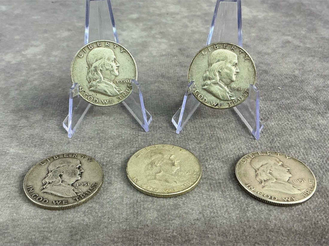 Franklin Halves: Five Benjamin Franklin half dollars ranging from 1950 to 1951, 90% silver. All in good circulated condition. Total weight 1.98 ozt.