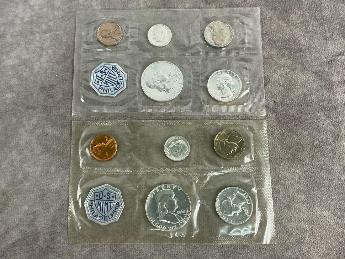 Philadelphia Proof Sets: 1961 and 1962 proof sets from Philadelphia mint. Both in good condition in original seal. Each measures 5.5 inches wide x 3.25 inches tall.