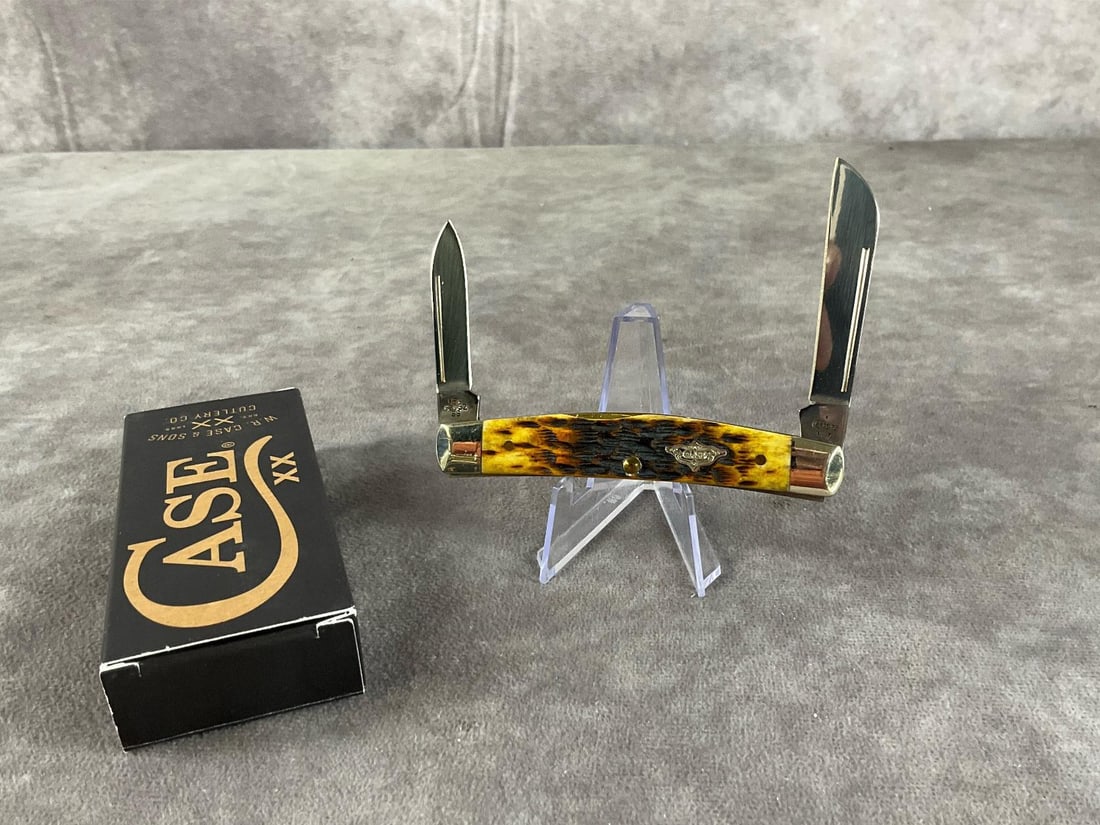 Burnt Amber Jigged Bone Knife: Case XX Half Congress 62052 SS. Tight snap, includes original box, box measures 4.5 inches wide X 1.75 inches tall.