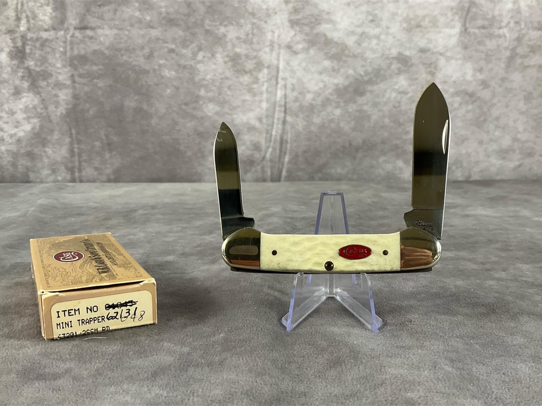 White Jigged Bone Knife: Case XX Canoe 62131 SS. Tight snap. Includes box, not original. Box measures 4.5 inches wide X 1.75 inches tall.