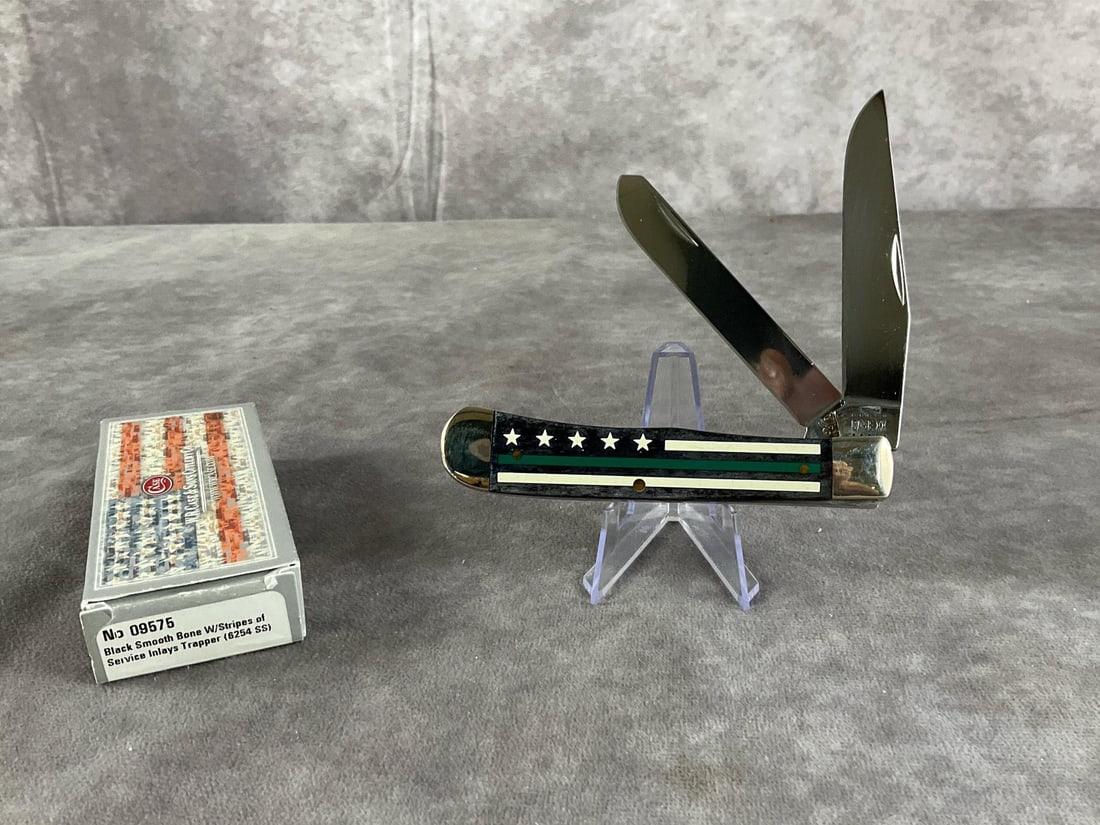 Black Smooth Bone with Stripes of Service Inlays: Case XX Trapper 6254 SS Tight snap, includes original box. Box measures 4.5 inches wide X 1.75 inches tall
